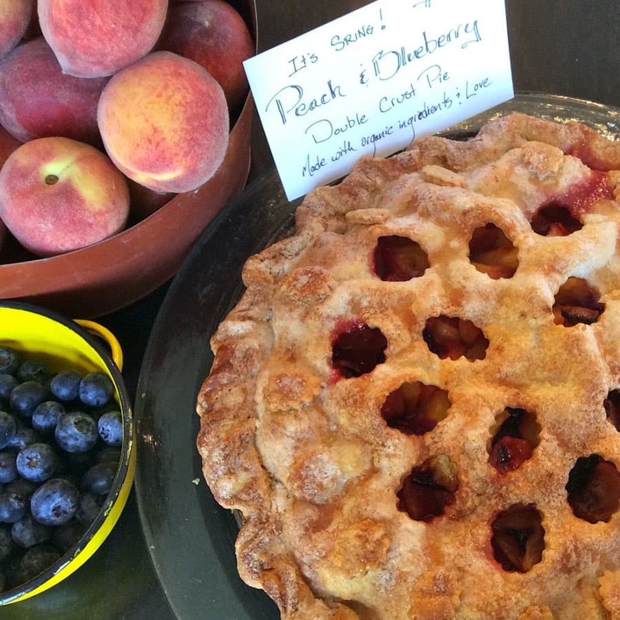 Fresh pie, peaches and blue berries