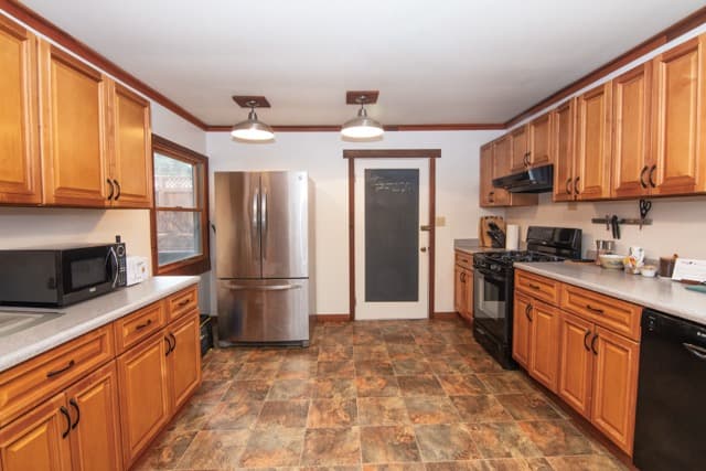 Fully equipped kitchen with modern appliances, spacious countertops, and everything needed for an extended stay.